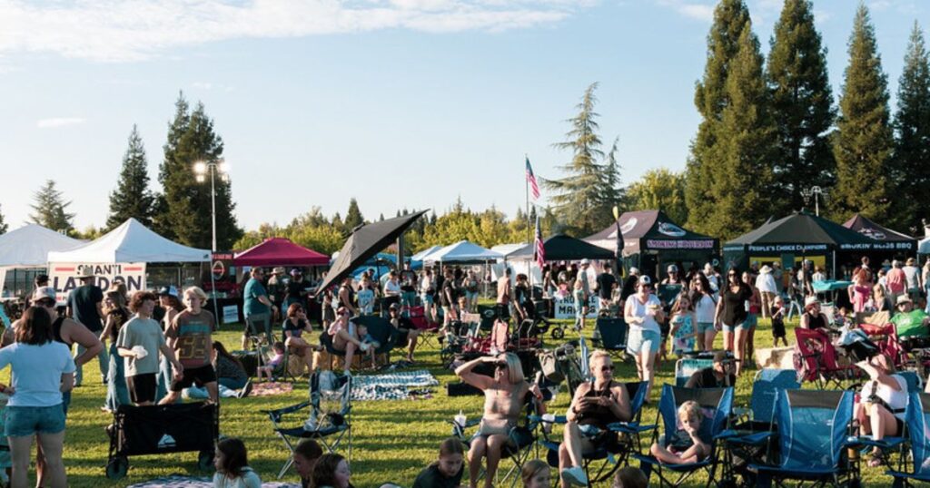 Community members savoring ribs and live entertainment at the 12 Bridges Rib Cook-Off event.