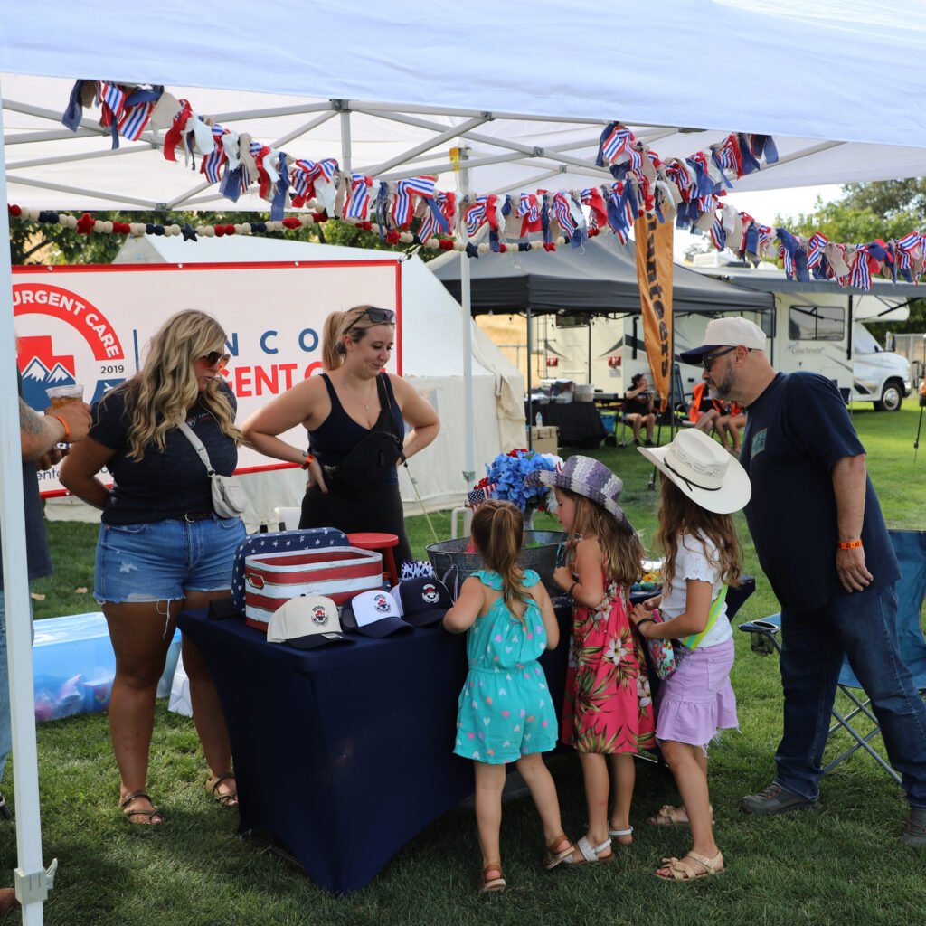 Sponsor booth display featuring branded setup as part of 12 Bridges Rib Cook-Off sponsorship.