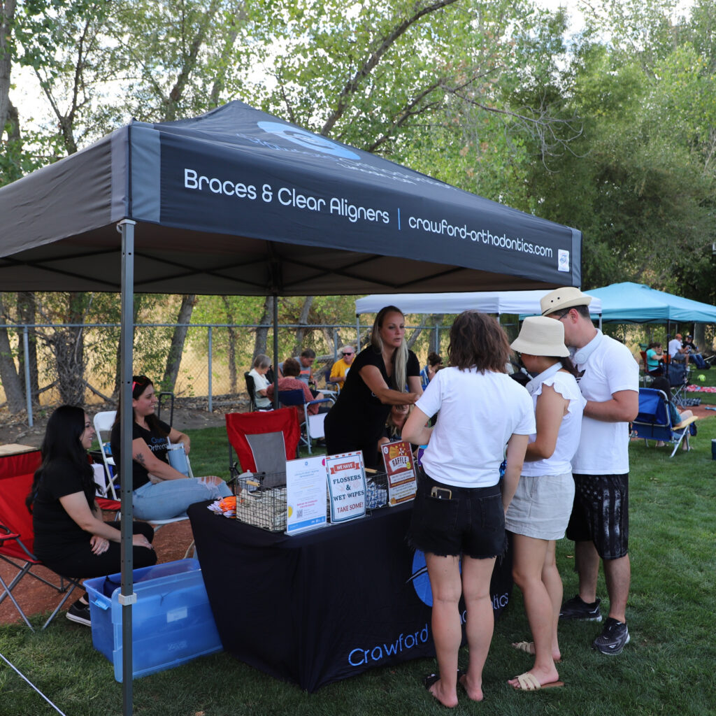 Sponsor booth positioned near the main stage highlighting 12 Bridges Rib Cook-Off sponsorship presence.