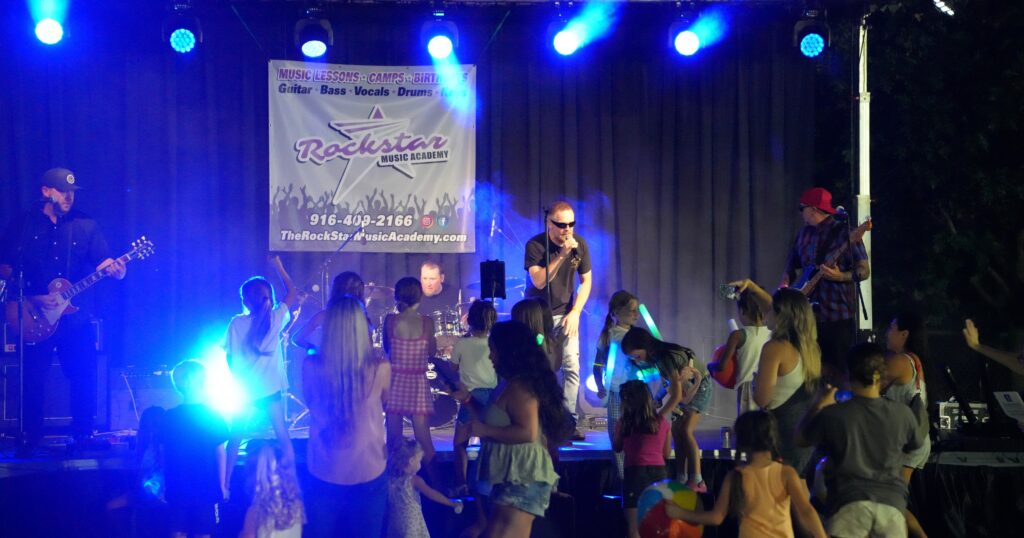 Kids enjoying their time & the listening to live music Zaddies Band, and Burke band at the 2025 12 Bridges Rib Cook-Off.